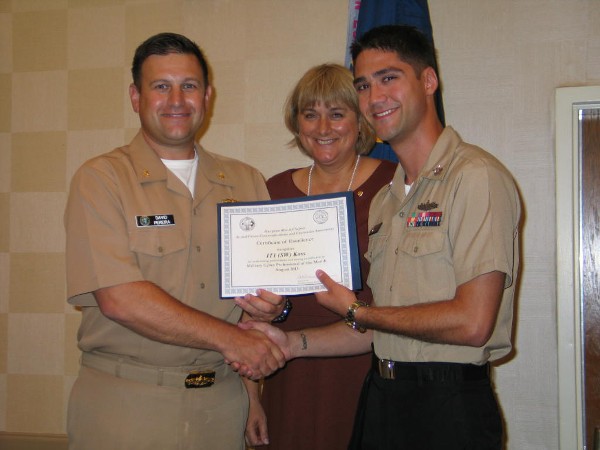 Lt. Cmdr. David Pereira, USN (l), chapter vice president, and Duvall present the August Military Cyber Professional of the Month Award to Petty Officer 1st Class Eric Koss, USN, commander, Submarine Force, U.S. Atlantic Fleet.